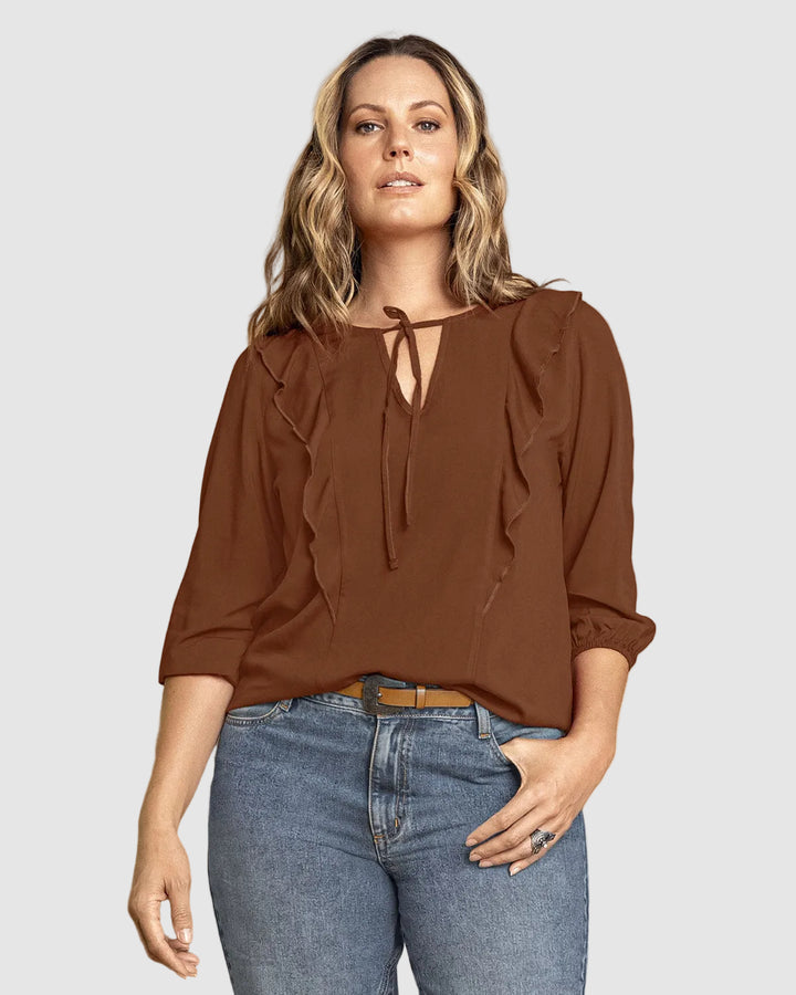 Blusa manga 3/4 con boleros sobrepuestos en frente