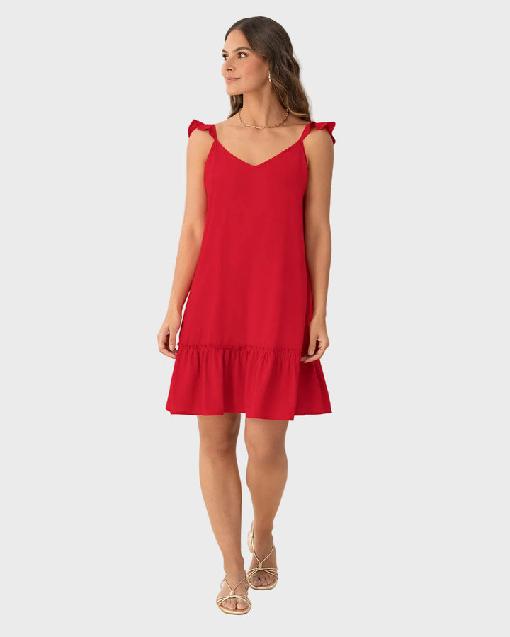 Vestido corto con bolero en mangas y ruedo