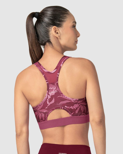 Top deportivo con espalda atlética en material de secado rápido#color_394-estampado-flores-vino