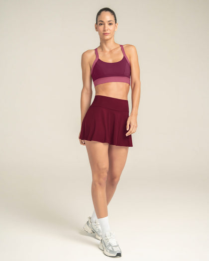 Falda deportiva con short interno con bolsillo#color_220-vinotinto