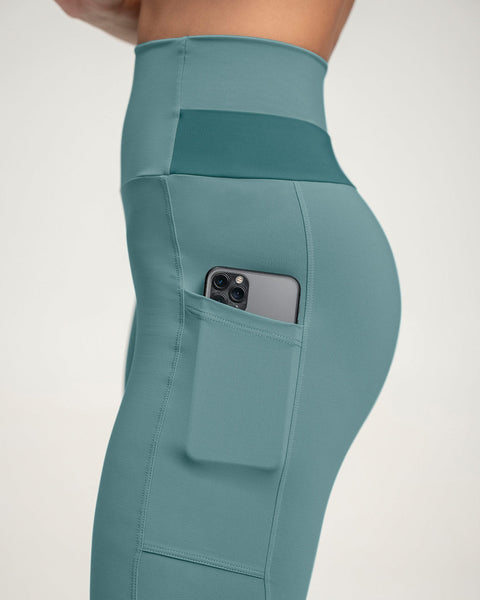 Legging tiro alto compresión en abdomen y muslos con bolsillo lateral#color_644-verde