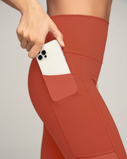 Legging deportivo con bolsillo lateral y detalles en SmartLace®#color_336-rojo-canela