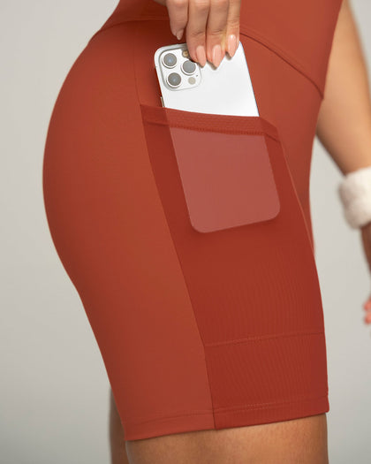 Short ciclista con bolsillo lateral y compresión de abdomen#color_336-rojo-canela