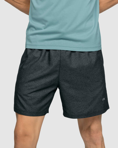 Pantaloneta deportiva con acabado antifluidos y bolsillos funcionales#color_071-estampado-gris