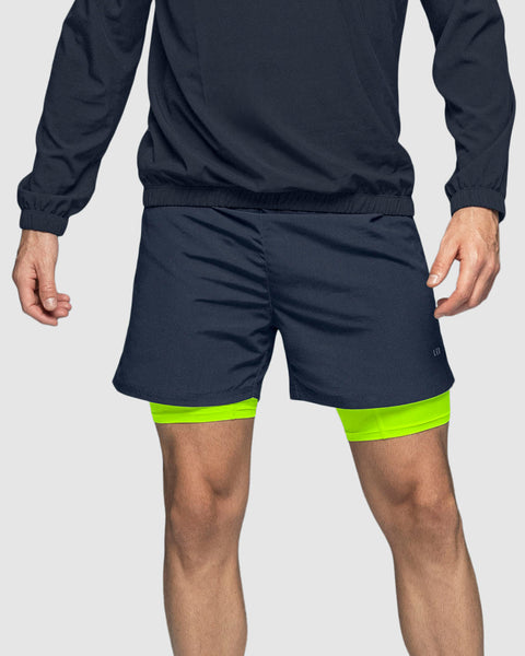 pantaloneta-deportiva-con-bolsillo-lateral-con-boxer-interno#color_536-azul-oscuro-verde-neon