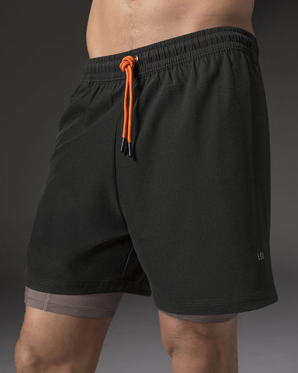 Pantaloneta deportiva con bolsillo lateral con bóxer interno#color_701-negro