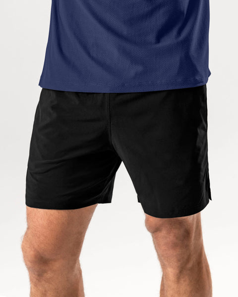 pantaloneta-deportiva-con-bolsillo-trasero-y-con-boxer-interno#color_700-negro