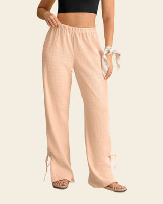 Pantalón amplio con textura y lazos en bota#color_304-rosado