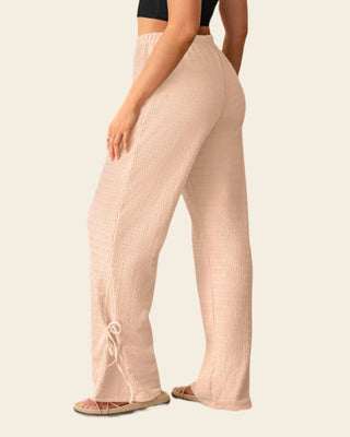 Pantalón amplio con textura y lazos en bota#color_304-rosado